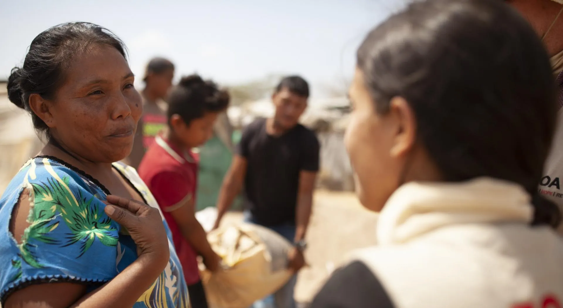 Woman talking to a ZOA worker in Colombia